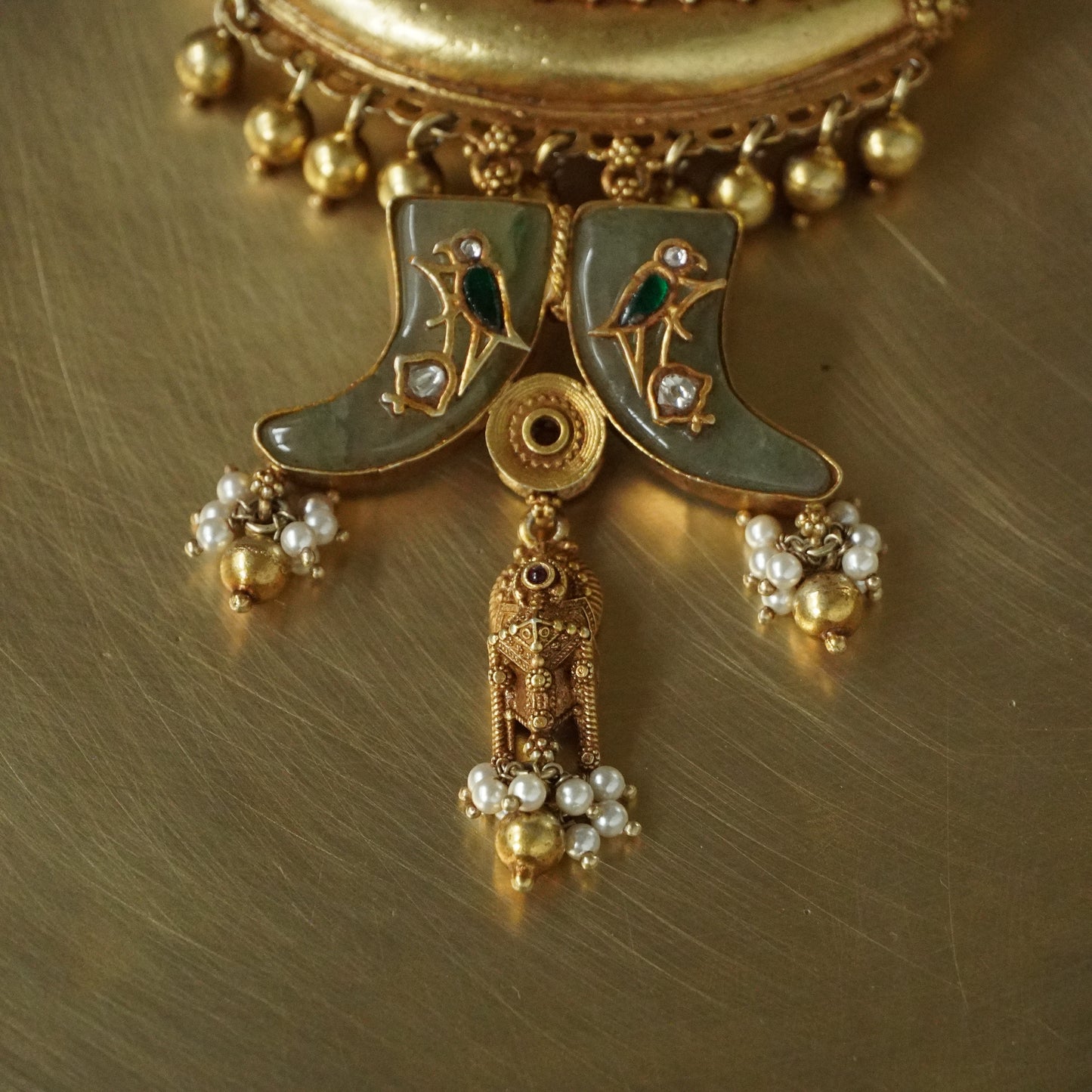 Sun Amulate with green gemstone tusks Pendant