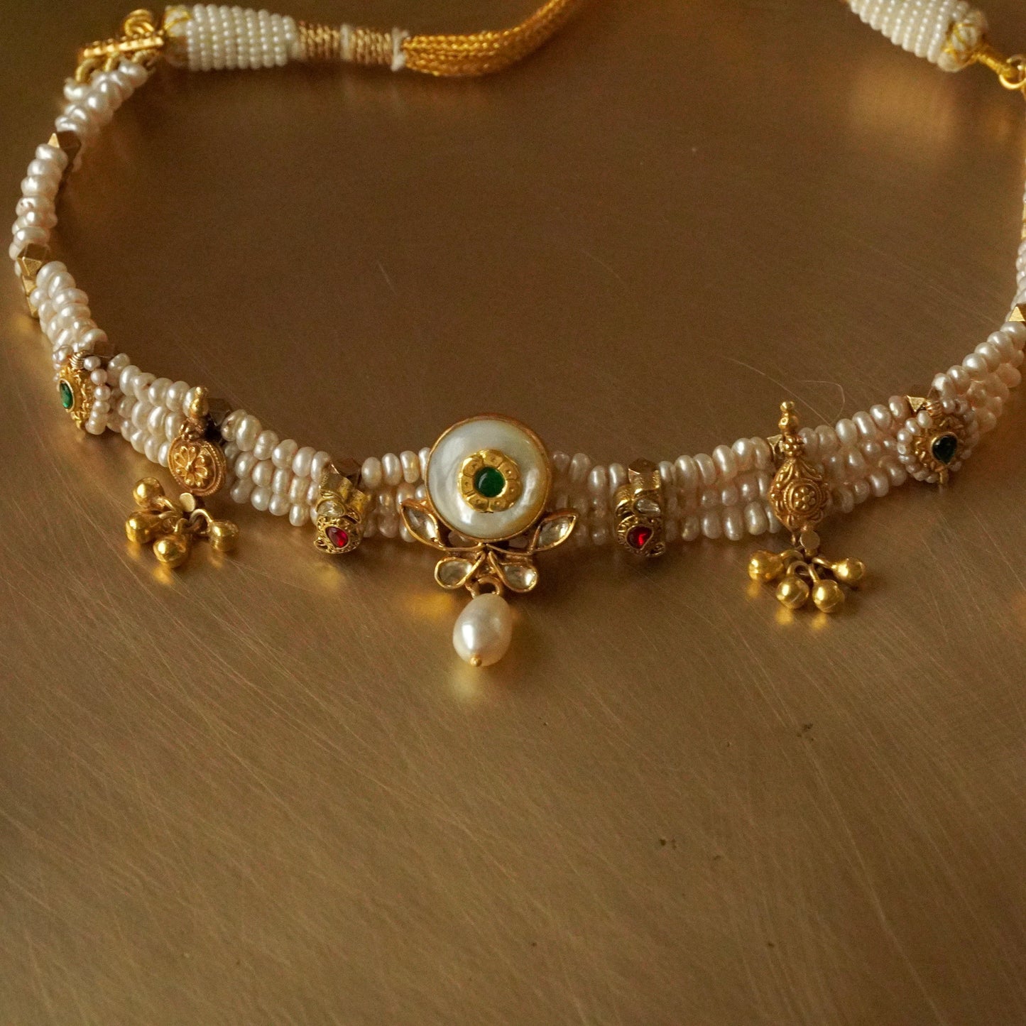 Centre white centre strung in pearl lines choker and earrings