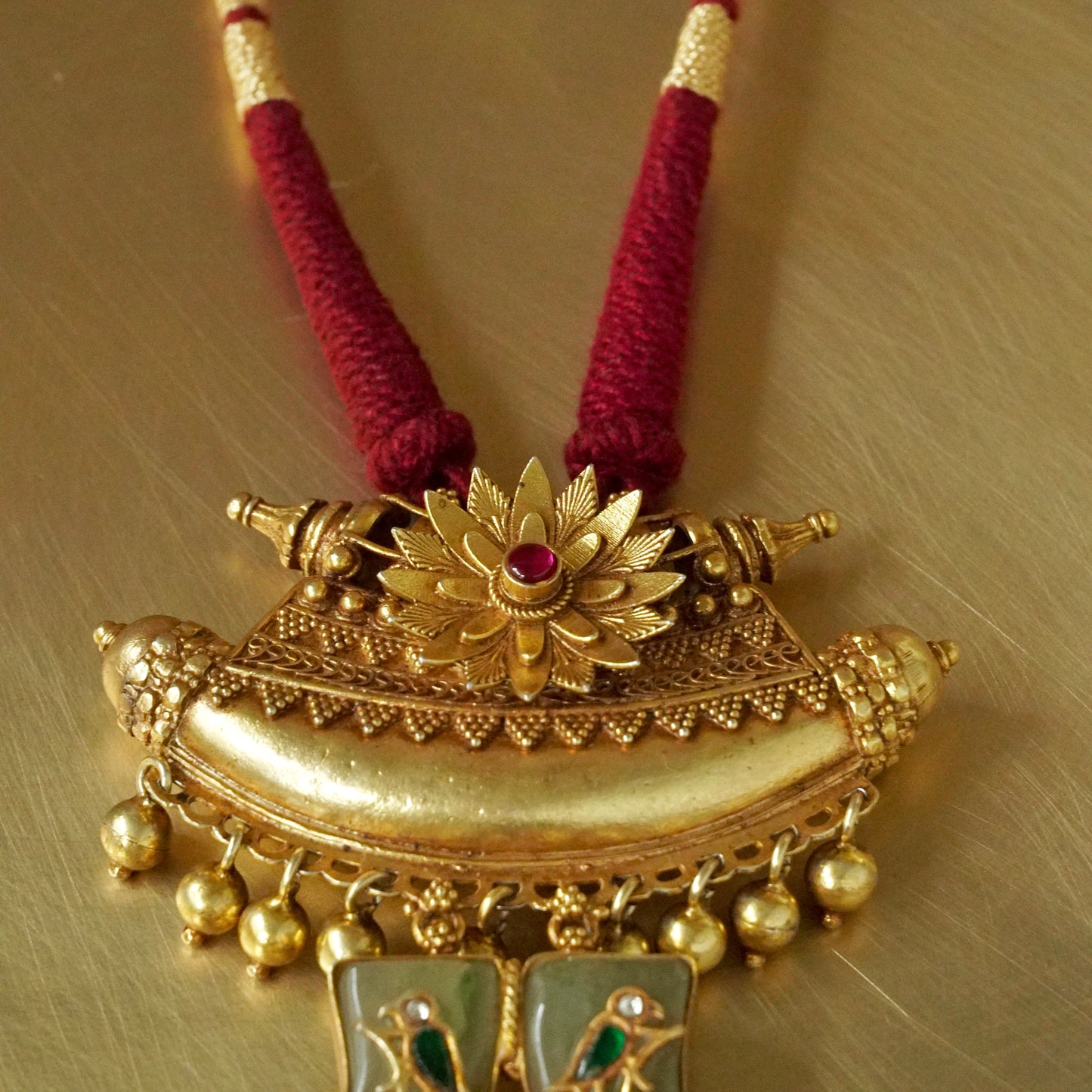 Sun Amulate with green gemstone tusks Pendant