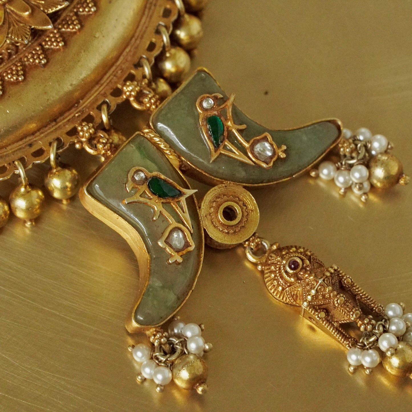Sun Amulate with green gemstone tusks Pendant