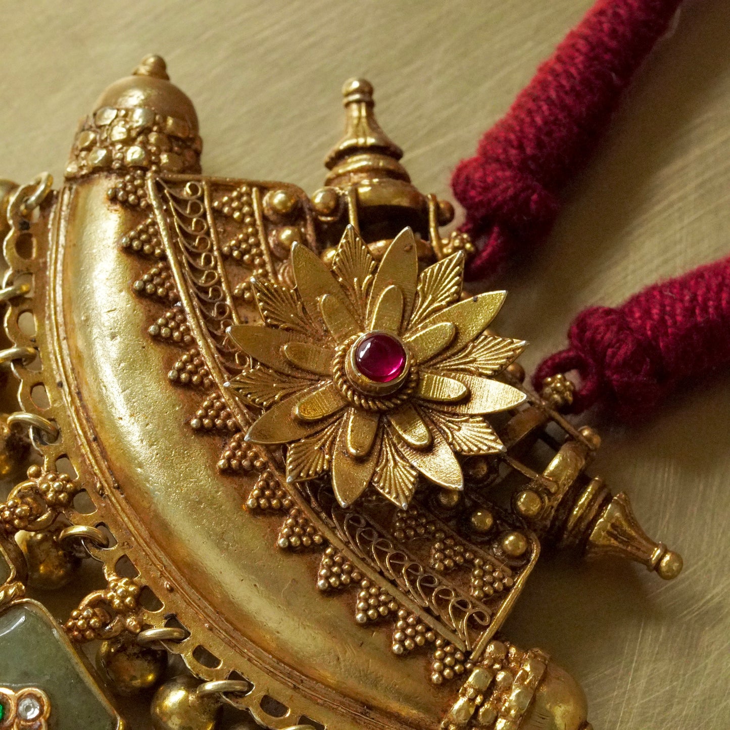 Sun Amulate with green gemstone tusks Pendant