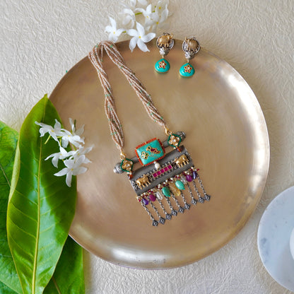 Firoza gemstone on Amulate over a Nagada piece fastened in fresh-water precious pearls and earrings